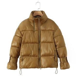 Detail view of winter puffer jacket with high collar and asymmetric double zipper design