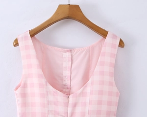 Close-up of pink gingham puff dress back featuring invisible zipper and hook closure