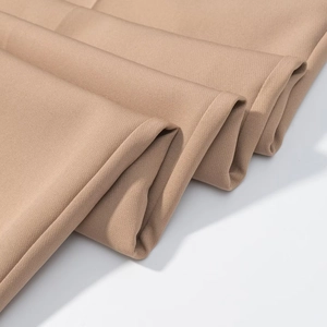 Close-up of khaki woven fabric showing texture and durability of the two-piece suit