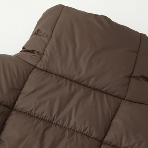 Quilted chocolate brown winter coat with classic square stitching and premium matte finish