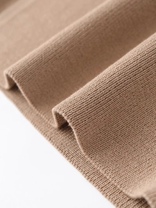 Close-up of premium brown rib-knit fabric texture with detailed fine stitching