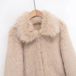 Chic beige faux fur winter jacket with oversized lapel and metal zip closure
