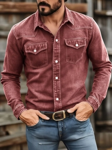 Detail of red-brown long sleeve work shirt with dual chest pockets and white buttons