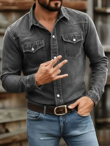 Detail of western-style grey denim shirt with white pearl snaps and shoulder yoke