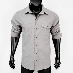 Detail of light gray long sleeve work shirt with double chest pockets on a mannequin