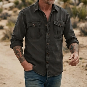 Men's charcoal grey long-sleeve cotton cargo shirt with zipper detail in outdoor setting
