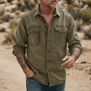 Detailed close-up of olive green cargo shirt with double chest pockets and vintage buttons
