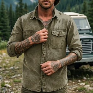 Outdoor shot of men's army green cotton utility shirt with vintage wash and dual chest pockets