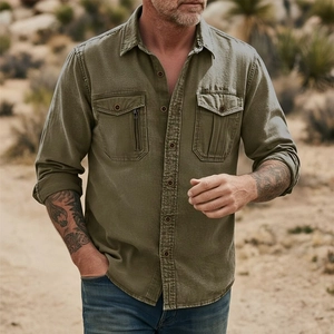 Close-up of military green tactical cotton shirt with dual chest pockets and zipper detail