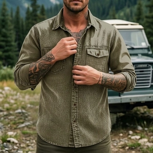 Detail of olive green heavy-duty cotton shirt with double chest pockets in forest setting
