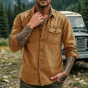 Close-up of durable men's work shirt with double chest pockets in rugged tan cotton