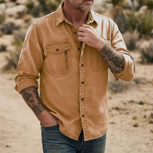 Close-up of camel cotton linen shirt featuring double chest pockets and metal zipper detail