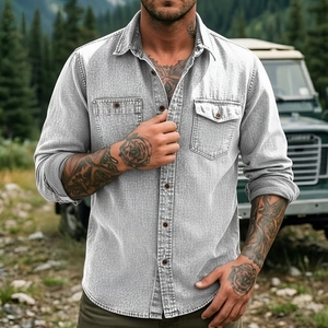 Detail of grey denim men shirt featuring double chest pockets and rugged outdoor utility style