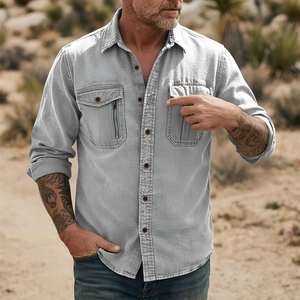 Close-up of washed gray cotton linen shirt with double chest pockets and zipper detail