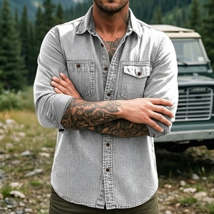 Detail of light gray long sleeve work shirt with double chest pockets in outdoor setting