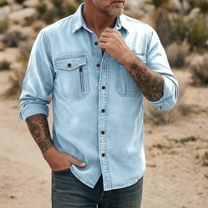 Detail of light blue linen cotton men's shirt with double chest pockets and zip detail