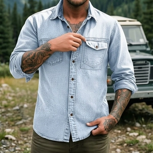 Close-up of men's blue denim shirt showing dual chest pockets and stitching details
