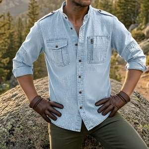 Detail of light blue linen shirt featuring military shoulder straps and chest pockets