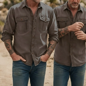 Outdoor shot of men's brownish grey cotton work shirt with double flap pockets and zippers