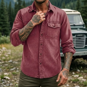 Detail of heavy fabric texture and chest pockets on a burgundy outdoor cargo shirt