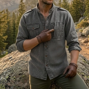 Detail of grey cotton linen men's shirt with military style pockets and epaulettes