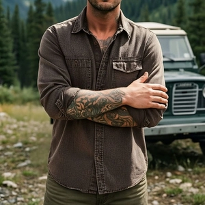 Close-up of brown vintage denim work shirt with dual chest pockets in outdoor setting