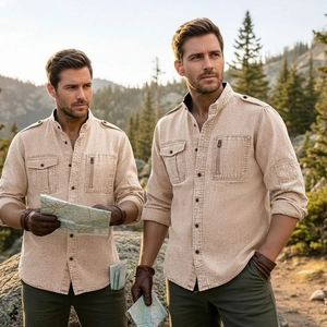Close-up of tactical khaki cotton shirt with epaulettes and functional zip pockets