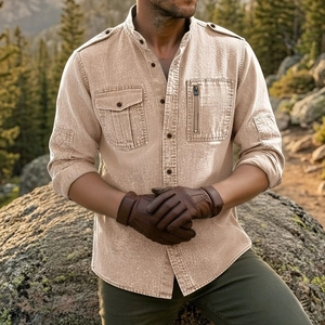 Detail of khaki tactical cotton shirt featuring functional chest pockets and epaulets