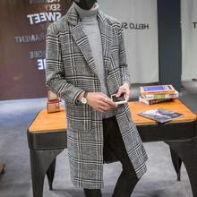 Detail shot of men's double-breasted grey plaid wool coat with notch lapels and pockets