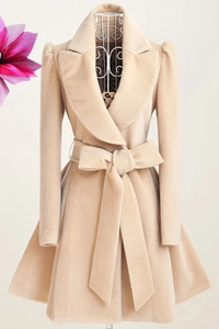 Elegant beige wool blend coat with waist tie belt and puff sleeves on mannequin