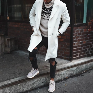 Outdoor street style shot of men's long wool coat in beige with stylish wide lapel