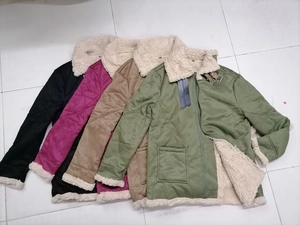 Flat lay of multiple faux suede jackets with thick sherpa fleece lining in four colors