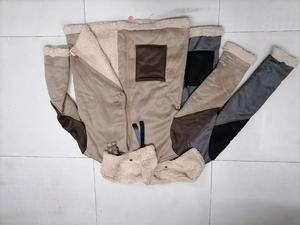 Detail of faux suede bomber jacket with thick faux shearling lining and buckle collar