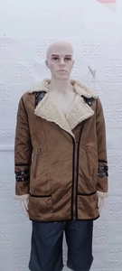 Detail of faux suede jacket featuring thick sherpa lining and buckled collar trim