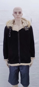 Men's suede jacket detail showing beige faux shearling lining and metal buckle straps