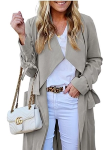 Detail of light grey long trench coat showing adjustable tie-cuffs and open-front structure