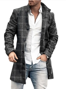 Detail of dark grey plaid wool coat with single-breasted design and premium fabric texture