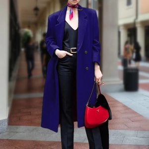 Elegant Klein blue double-breasted long wool coat with classic lapels for women