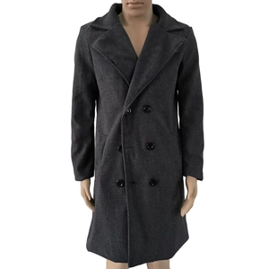 Detail of dark grey wool overcoat featuring classic double-breasted buttons and notched lapel