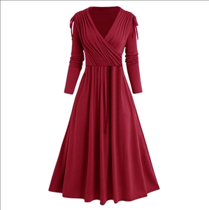 Detailed view of deep red maxi dress with V-neck wrap design and pleated bust details
