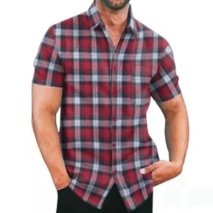 Detail of red and black plaid men shirt featuring classic collar and front pocket