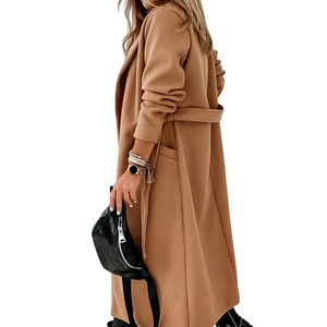 Detail view of long camel wool coat with waist tie belt and side pockets for women