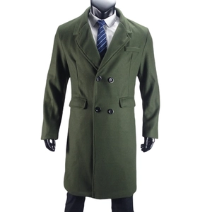 Detail of army green wool coat featuring double-breasted buttons and classic lapel