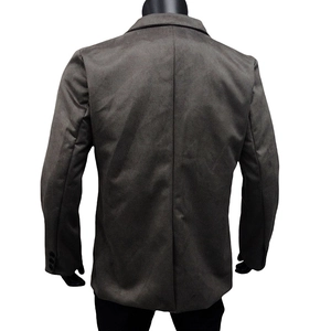 Detail view of dark brown suit jacket back featuring slim waist cut and three sleeve buttons