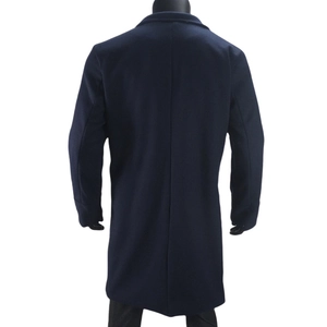 Rear view of long dark blue wool coat for men showing straight cut and back seam detail
