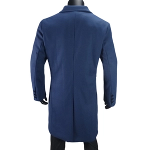 Rear view of navy blue wool coat featuring a center seam, back vent, and buttoned cuffs