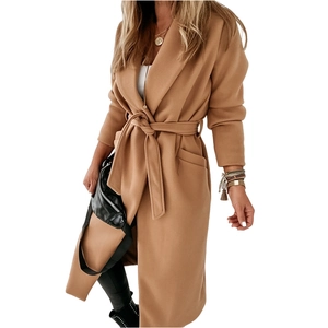 Detailed view of the lapel and waist tie on this camel long wool blend coat for women