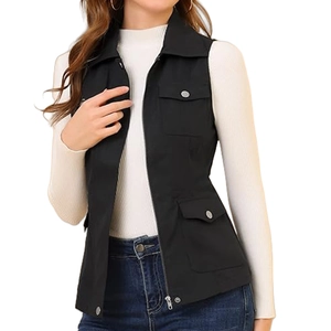 Detail shot of black cargo vest zipper and multi-pocket design with metallic buttons