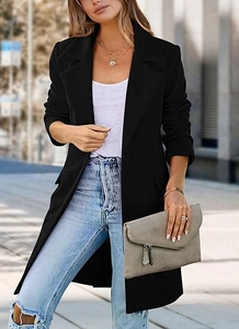 Detail of a women's black wool coat styled with a grey clutch bag and denim jeans