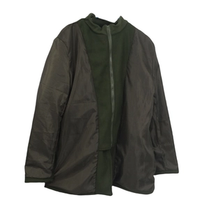 Detail of olive green wool coat featuring a stand collar and contrasting brown lining